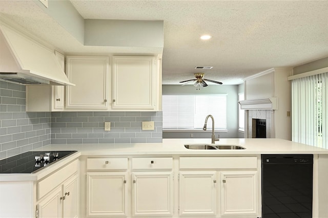 3114 Hollow Creek Ct, Houston, TX 77082 - kitchen with black appliances, a sink, custom exhaust hood, a peninsula, and a ceiling fan
