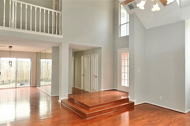 3114 Hollow Creek Ct, Houston, TX 77082 - entrance foyer with plenty of natural light, wood finished floors, a chandelier, a towering ceiling, and baseboards