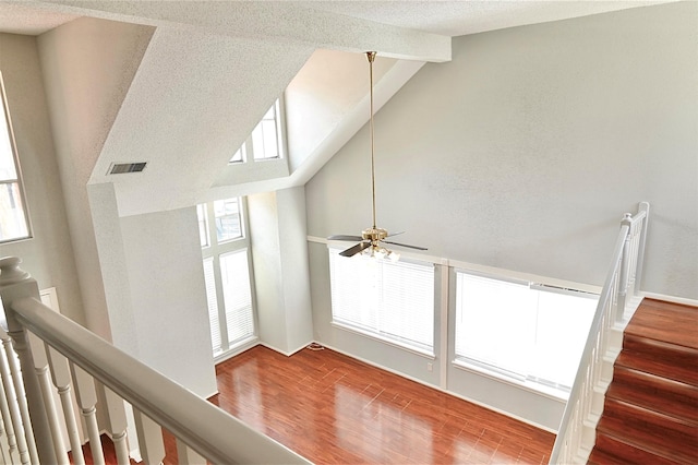 3114 Hollow Creek Ct, Houston, TX 77082 - hallway featuring wood finished floors, beam ceiling, high vaulted ceiling, and a textured ceiling