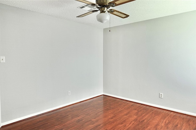 3114 Hollow Creek Ct, Houston, TX 77082 - empty room with wood finished floors, a ceiling fan, baseboards, and a textured ceiling