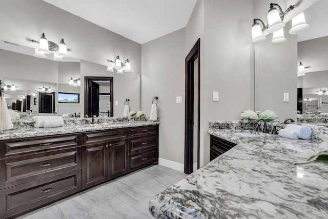 5912 T St, Katy, TX 77493 - bathroom with marble finish flooring and two vanities