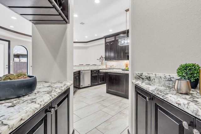 5912 T St, Katy, TX 77493 - kitchen with dishwasher, crown molding, light stone countertops, recessed lighting, and light marble finish floors