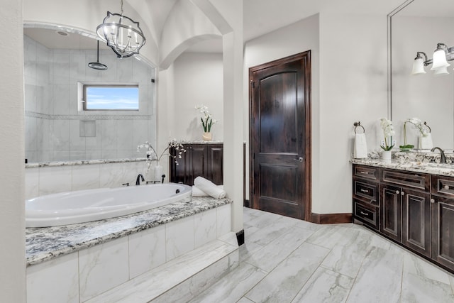 5912 T St, Katy, TX 77493 - full bath with tiled bath, vanity, marble finish flooring, a tile shower, and baseboards