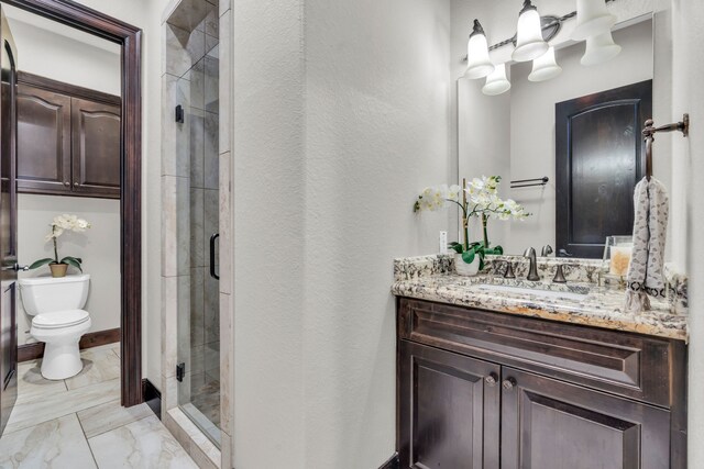 5912 T St, Katy, TX 77493 - full bathroom featuring vanity, a stall shower, toilet, marble look tiles, and a textured wall