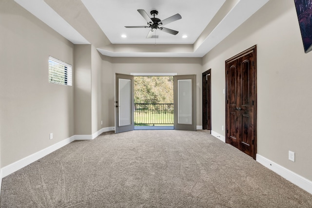 5912 T St, Katy, TX 77493 - spare room with ceiling fan, carpet, a raised ceiling, baseboards, and recessed lighting