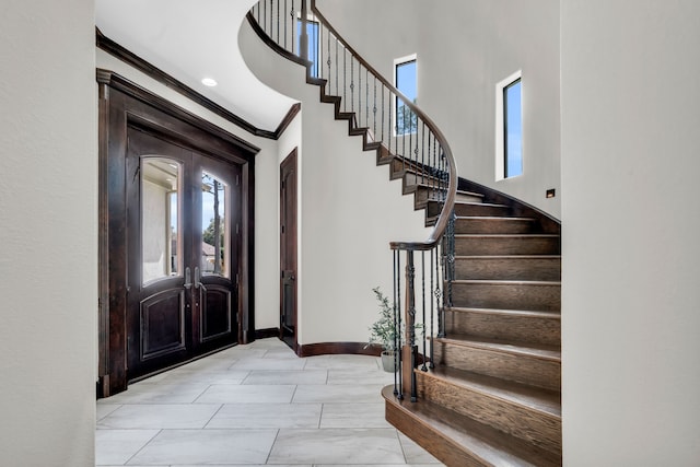 5912 T St, Katy, TX 77493 - entrance foyer with healthy amount of natural light, stairway, ornamental molding, baseboards, and a high ceiling