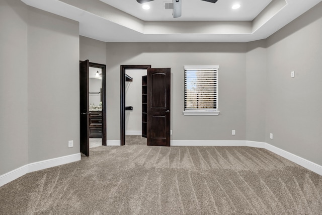 5912 T St, Katy, TX 77493 - carpeted spare room featuring a raised ceiling, ceiling fan, baseboards, and recessed lighting