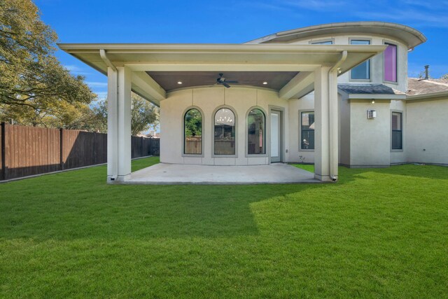 5912 T St, Katy, TX 77493 - rear view of house featuring ceiling fan, a patio area, and stucco siding