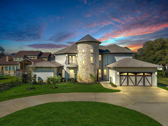 5912 T St, Katy, TX 77493 - view of front of house featuring driveway, a balcony, stucco siding, and a garage
