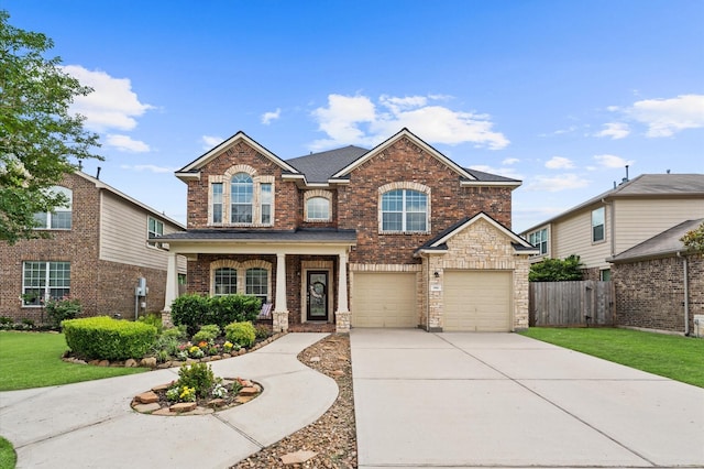 406 Oak Stream Dr, Conroe, TX 77304 - traditional-style house with concrete driveway, brick siding, a garage, and covered porch