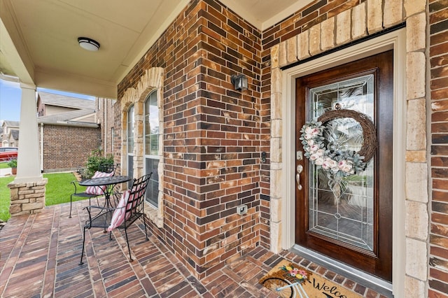 406 Oak Stream Dr, Conroe, TX 77304 - property entrance featuring covered porch and brick siding