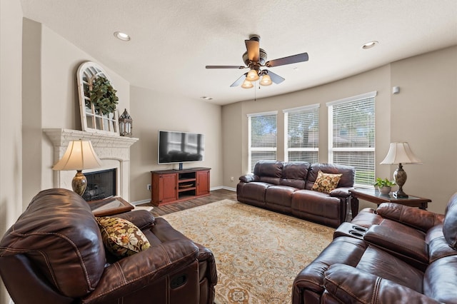 406 Oak Stream Dr, Conroe, TX 77304 - living area with a ceiling fan, wood finished floors, a fireplace, recessed lighting, and baseboards