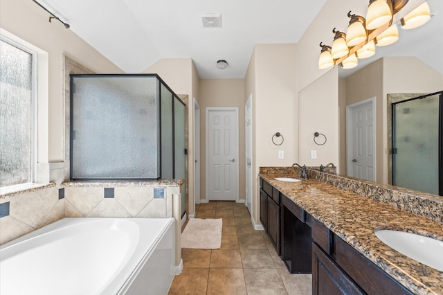 406 Oak Stream Dr, Conroe, TX 77304 - bathroom with a stall shower, double vanity, a garden tub, and tile patterned floors