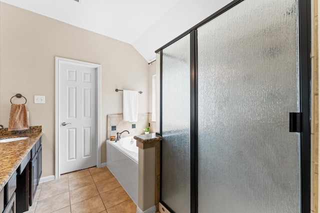 406 Oak Stream Dr, Conroe, TX 77304 - bathroom featuring a shower stall, a bath, tile patterned floors, vanity, and vaulted ceiling