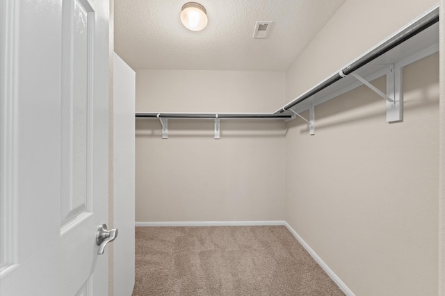 406 Oak Stream Dr, Conroe, TX 77304 - walk in closet featuring carpet floors
