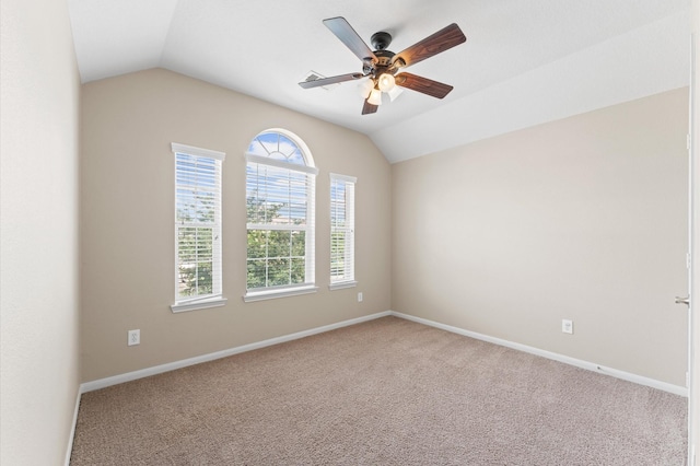 406 Oak Stream Dr, Conroe, TX 77304 - carpeted empty room featuring vaulted ceiling, ceiling fan, and baseboards