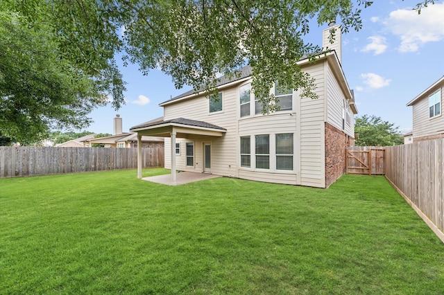 406 Oak Stream Dr, Conroe, TX 77304 - rear view of property with a patio, a chimney, and brick siding
