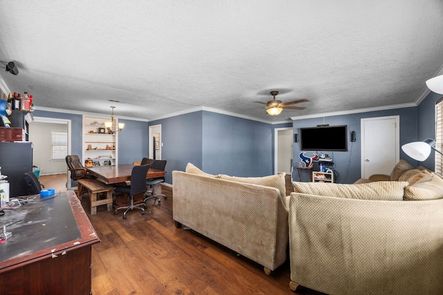 917 Alvin St, Pasadena, TX 77506 - living area with dark wood-style floors, a chandelier, a ceiling fan, ornamental molding, and a textured ceiling