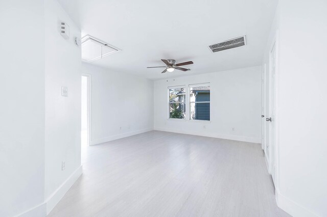 24034 River Place Dr, Katy, TX 77494 - spare room with attic access, light wood-type flooring, baseboards, and a ceiling fan