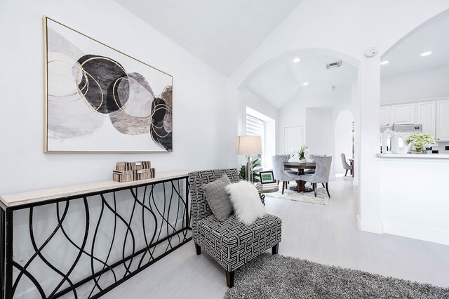 24034 River Place Dr, Katy, TX 77494 - living area featuring arched walkways, vaulted ceiling, wood finished floors, recessed lighting, and baseboards