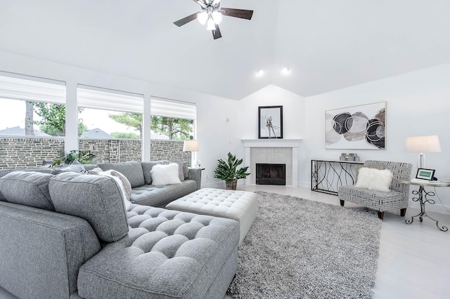 24034 River Place Dr, Katy, TX 77494 - living room with a ceiling fan, vaulted ceiling, and a tile fireplace