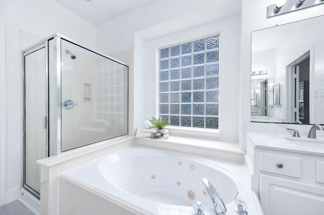 24034 River Place Dr, Katy, TX 77494 - full bathroom featuring a shower stall, a tub with jets, vanity, and healthy amount of natural light