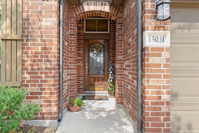 15031 Appian Oak St, Cypress, TX 77429 - doorway to property featuring brick siding