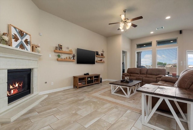 15031 Appian Oak St, Cypress, TX 77429 - living area featuring ceiling fan, a glass covered fireplace, recessed lighting, and baseboards