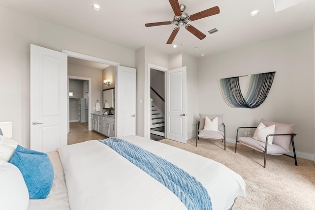 111 E 2nd St, Houston, TX 77007 - bedroom with recessed lighting, baseboards, connected bathroom, light colored carpet, and a ceiling fan