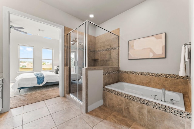 111 E 2nd St, Houston, TX 77007 - ensuite bathroom featuring a ceiling fan, a bath, a shower stall, and tile patterned flooring