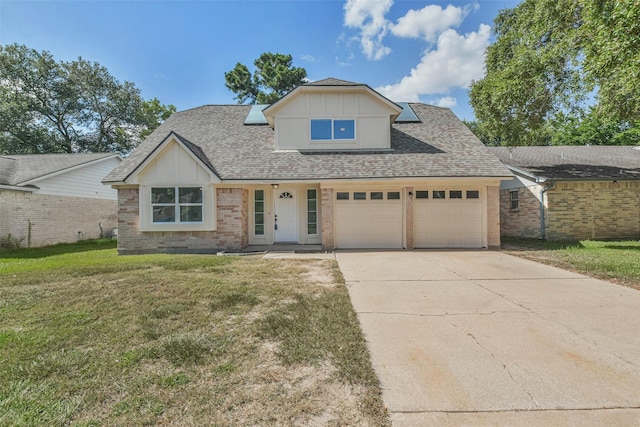 16538 Park Scot Dr, Houston, TX 77084 - view of front of home with a front yard, a garage, driveway, and a shingled roof