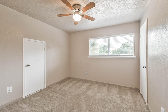 16538 Park Scot Dr, Houston, TX 77084 - carpeted spare room with a textured ceiling, a ceiling fan, and baseboards