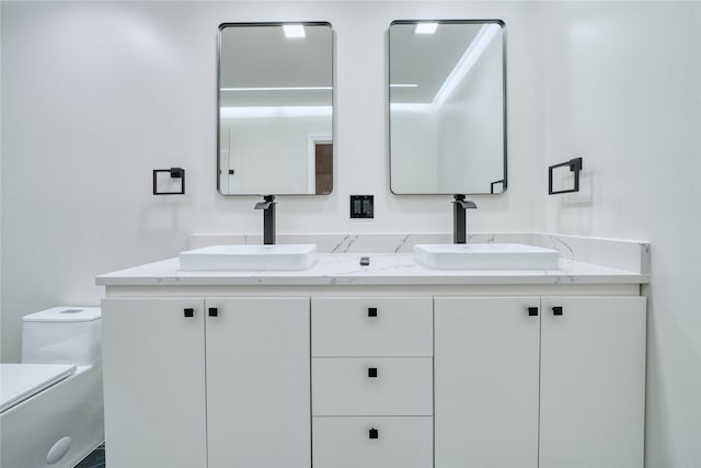 16538 Park Scot Dr, Houston, TX 77084 - bathroom featuring double vanity and toilet