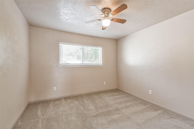 16538 Park Scot Dr, Houston, TX 77084 - spare room with carpet, ceiling fan, a textured ceiling, and baseboards