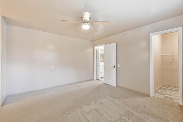 16538 Park Scot Dr, Houston, TX 77084 - unfurnished bedroom featuring carpet flooring, baseboards, washer / dryer, and a ceiling fan
