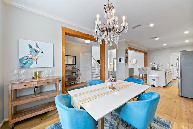 1538 Bevis St, Houston, TX 77008 - dining room with a chandelier, stairs, recessed lighting, crown molding, and light wood-style floors