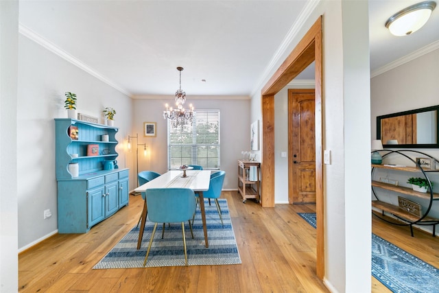 1538 Bevis St, Houston, TX 77008 - dining area with light wood finished floors, crown molding, a chandelier, and baseboards