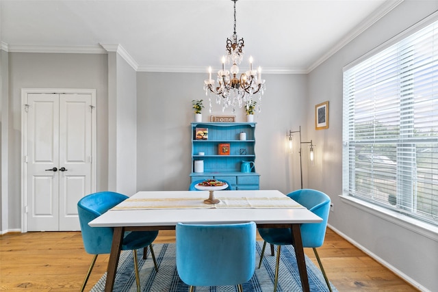1538 Bevis St, Houston, TX 77008 - dining room featuring a chandelier, light wood-style floors, crown molding, and baseboards