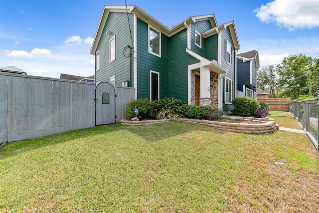 1538 Bevis St, Houston, TX 77008 - view of front facade featuring a gate and stone siding