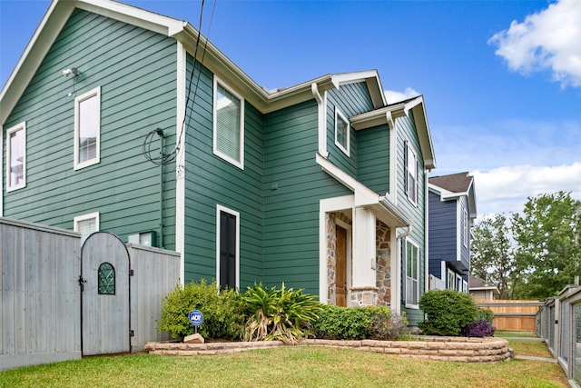 1538 Bevis St, Houston, TX 77008 - view of front facade with stone siding and a gate