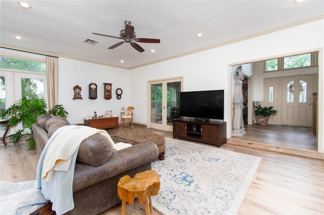 901 Hartrick Canyon Dr, Temple, TX 76502 - living room with healthy amount of natural light, wood finished floors, ornamental molding, a ceiling fan, and french doors