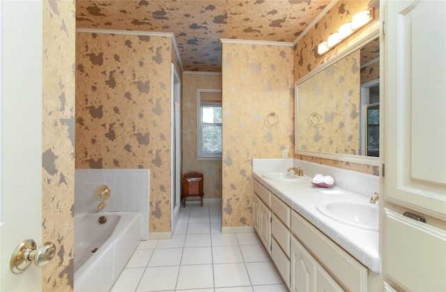 901 Hartrick Canyon Dr, Temple, TX 76502 - bathroom featuring wallpapered walls, tile patterned floors, double vanity, a bath, and baseboards