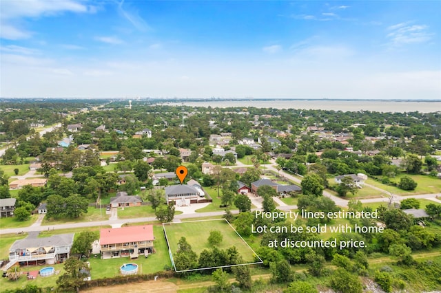 610 S Shady Ln, Shoreacres, TX 77571 - aerial perspective of suburban area featuring property parcel outlined and a large body of water