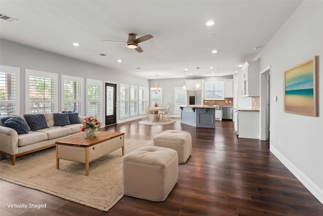 610 S Shady Ln, Shoreacres, TX 77571 - living room featuring ceiling fan, recessed lighting, dark wood finished floors, baseboards, and a chandelier