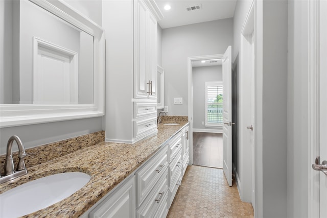 610 S Shady Ln, Shoreacres, TX 77571 - bathroom featuring double vanity and recessed lighting