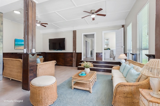 610 S Shady Ln, Shoreacres, TX 77571 - living room featuring ceiling fan and wainscoting