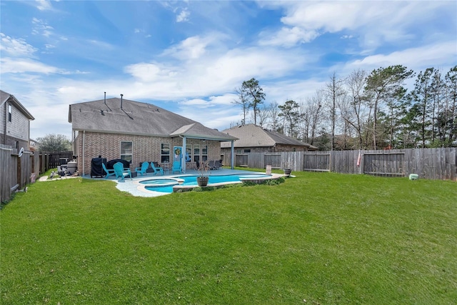 21275 Lily Springs Dr, Porter, TX 77365 - back of house with a fenced backyard, brick siding, a pool with connected hot tub, and a patio area