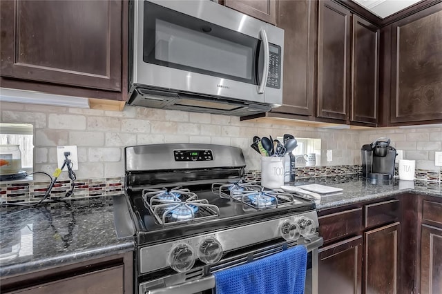 21275 Lily Springs Dr, Porter, TX 77365 - kitchen featuring appliances with stainless steel finishes, backsplash, and dark brown cabinets