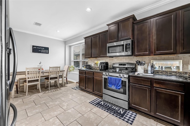21275 Lily Springs Dr, Porter, TX 77365 - kitchen featuring appliances with stainless steel finishes, tasteful backsplash, ornamental molding, dark brown cabinetry, and light tile patterned flooring