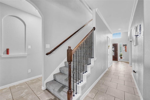 21275 Lily Springs Dr, Porter, TX 77365 - stairway with tile patterned flooring, arched walkways, and crown molding